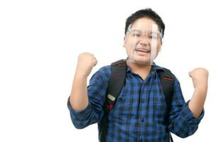 Asian boy student wear face shield excited surprised or make winner gesture photo