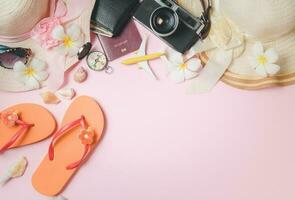 Summer vacation concept flat lay. Hat with sunglasses, slippers and Beach accessories photo