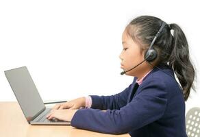 Cute student wear headphone and  learning with laptop isolated on white background. photo