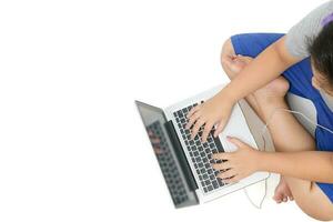 boy student playing computer with headsets  and enjoy online learning top view photo