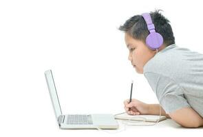 Obese boy student wear headphone study online at home isolated photo