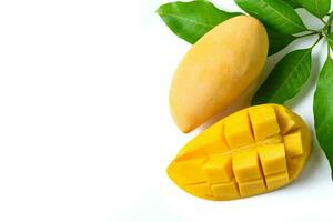 Delicious slide ripe yellow mango with green leaf isolated photo