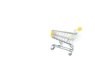 Empty shopping trolley isolated on white photo