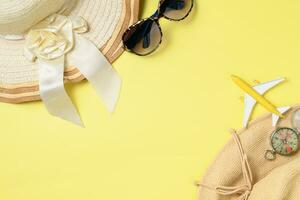 Summer vacation concept flat lay. Hat with sunglasses and  Beach accessories photo