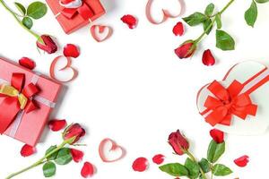 Heart gift box and red roses with heart red ribbon and rose petals photo