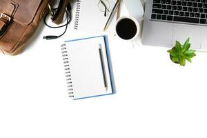 White office desk table Blank notebook with laptop computer, photo