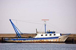 Moored fishing boat photo