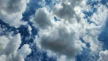 Fluffy Clouds in blue sky photo