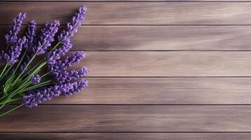 Lavender on wooden table, top view and copy space, summer concept. . photo