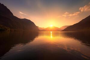 a beautiful sunset over a lake with mountains in the background. photo