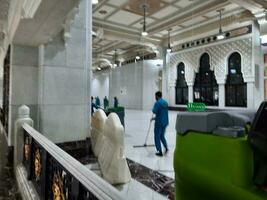 Mecca, Saudi Arabia, April 2023 - Cleaning crews are engaged in cleaning work between Safa and Marwah in Masjid al-Haram, Mecca. photo