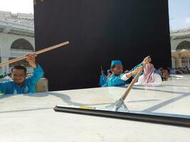 Mecca, Saudi Arabia, May 2023 - A beautiful view of cleaning Hateem during daytime near the Kaaba in the courtyard of Masjid al-Haram, Mecca. photo