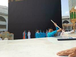 Mecca, Saudi Arabia, May 2023 - A beautiful view of cleaning Hateem during daytime near the Kaaba in the courtyard of Masjid al-Haram, Mecca. photo