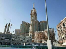 Mecca, Saudi Arabia, April 2023 - A beautiful daytime view of the Makkah Clock Tower from the courtyard of Masjid al-Haram, Mecca. photo