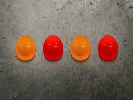 Fire alarm with safety helmet on cement wall in standard shopping malls, hotels and public places. photo