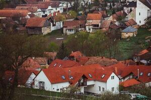 Rimetea is a small village located in Transylvania, Romania. It is situated in the Apuseni Mountains and is known for its picturesque setting and well preserved Hungarian architectural style. photo