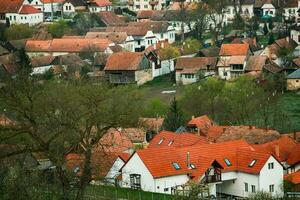 Rimetea is a small village located in Transylvania, Romania. It is situated in the Apuseni Mountains and is known for its picturesque setting and well preserved Hungarian architectural style. photo