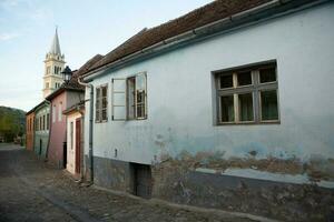 A beautiful medieval citadel city of Sighisoara in the heart of Romania, Transylvania travel destination in Eastern Europe. photo