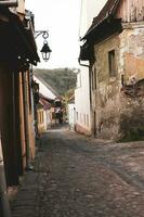 A beautiful medieval citadel city of Sighisoara in the heart of Romania, Transylvania travel destination in Eastern Europe. photo
