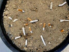 Sandbox for disposing of cigarette butts concept of cleanliness photo