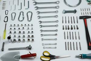 Set of tools for repair in a case on a white background. Assorted work or construction tools. Wrenches, Pliers, screwdriver. Top view photo