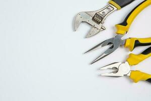 Set of tools for repair in a case on a white background. Assorted work or construction tools. Wrenches, Pliers, screwdriver. Top view photo