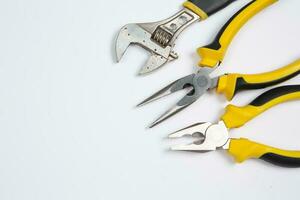 Set of tools for repair in a case on a white background. Assorted work or construction tools. Wrenches, Pliers, screwdriver. Top view photo