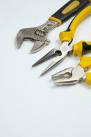 Set of tools for repair in a case on a white background. Assorted work or construction tools. Wrenches, Pliers, screwdriver. Top view photo