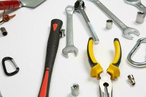 Set of tools for repair in a case on a white background. Assorted work or construction tools. Wrenches, Pliers, screwdriver. Top view photo