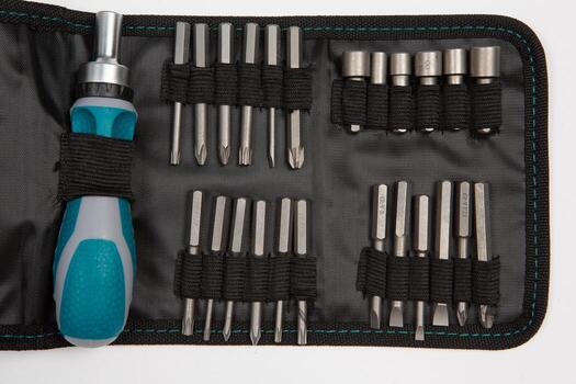 Set of tools for repair in a case on a white background. Assorted work or construction tools. Wrenches, Pliers, screwdriver. Top view photo