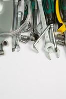 Set of tools for repair in a case on a white background. Assorted work or construction tools. Wrenches, Pliers, screwdriver. Top view photo