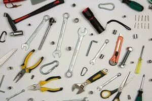 Set of tools for repair in a case on a white background. Assorted work or construction tools. Wrenches, Pliers, screwdriver. Top view photo