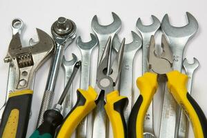 Set of tools for repair in a case on a white background. Assorted work or construction tools. Wrenches, Pliers, screwdriver. Top view photo