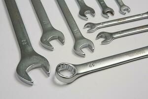 Set of tools for repair in a case on a white background. Assorted work or construction tools. Wrenches, Pliers, screwdriver. Top view photo