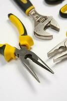 Set of tools for repair in a case on a white background. Assorted work or construction tools. Wrenches, Pliers, screwdriver. Top view photo