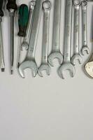 Set of tools for repair in a case on a white background. Assorted work or construction tools. Wrenches, Pliers, screwdriver. Top view photo