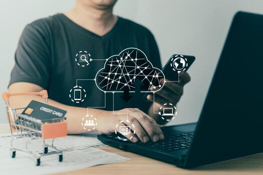 man use laptop and cloud computing diagram show on screen.Data storage.the use of online digital network technology in business, buying and selling commerce online digital marketplace photo
