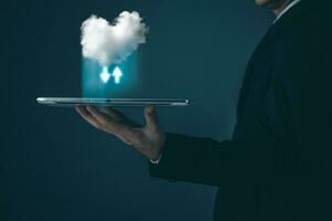 man hold tablet cloud computing system diagram show on hand.Data storage.Digital technology network service business in wireless storage concept. Implementing storage technology support in business. photo