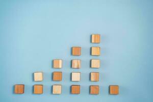 blank wooden cubes on blue background photo