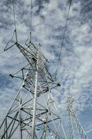 High-voltage power lines at sunset. Electricity distribution station.  electricity pylons on the background of the sky photo