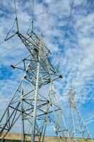 High-voltage power lines at sunset. Electricity distribution station.  electricity pylons on the background of the sky photo