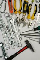 Set of tools for repair in a case on a white background. Assorted work or construction tools. Wrenches, Pliers, screwdriver. Top view photo