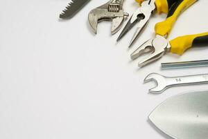 Set of tools for repair in a case on a white background. Assorted work or construction tools. Wrenches, Pliers, screwdriver. Top view photo