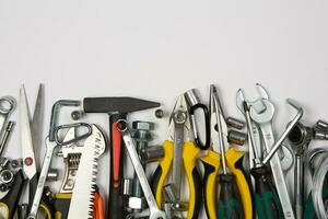 Set of tools for repair in a case on a white background. Assorted work or construction tools. Wrenches, Pliers, screwdriver. Top view photo