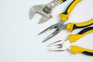 Set of tools for repair in a case on a white background. Assorted work or construction tools. Wrenches, Pliers, screwdriver. Top view photo