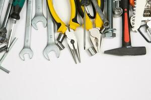 Set of tools for repair in a case on a white background. Assorted work or construction tools. Wrenches, Pliers, screwdriver. Top view photo