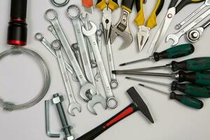 Set of tools for repair in a case on a white background. Assorted work or construction tools. Wrenches, Pliers, screwdriver. Top view photo