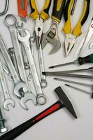 Set of tools for repair in a case on a white background. Assorted work or construction tools. Wrenches, Pliers, screwdriver. Top view photo