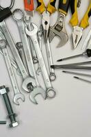 Set of tools for repair in a case on a white background. Assorted work or construction tools. Wrenches, Pliers, screwdriver. Top view photo