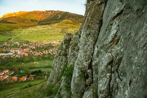 Rimetea is a small village located in Transylvania, Romania. It is situated in the Apuseni Mountains and is known for its picturesque setting and well preserved Hungarian architectural style. photo